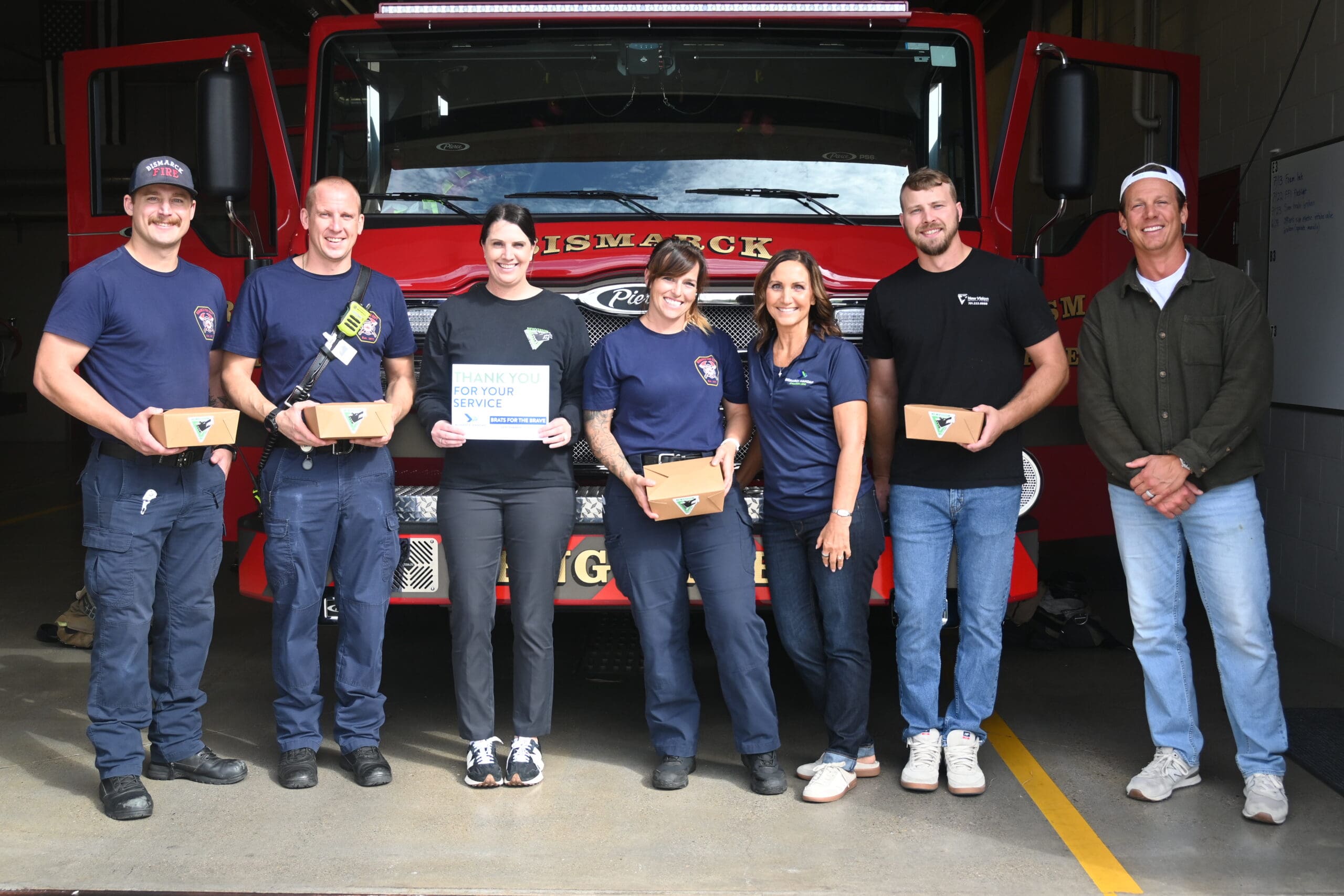 NewVision Security team with Bismarck firefighters at Brats for the Brave lunch delivery